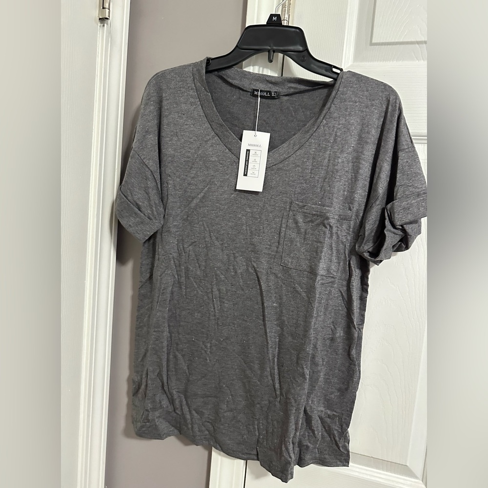 Brand new with tag short sleeve pocket tee size large